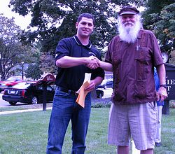2009_08_22 Chess Tournament Director presents the photographer (me) with prize